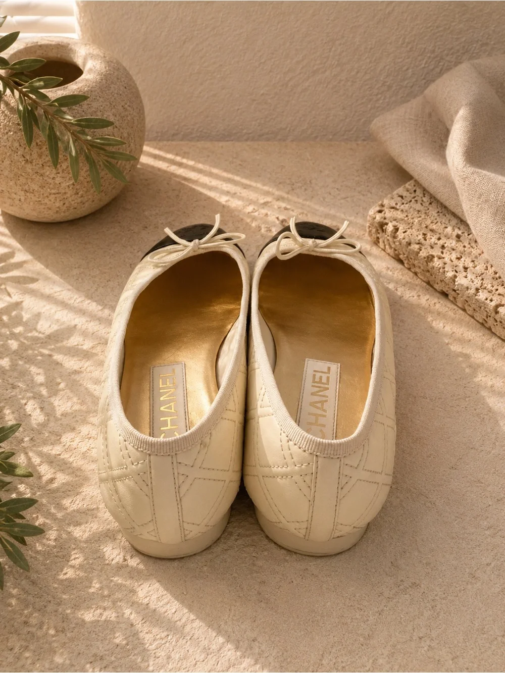 CHANEL Cream Quilted Leather Ballet Flats with Black Patent Cap Toe